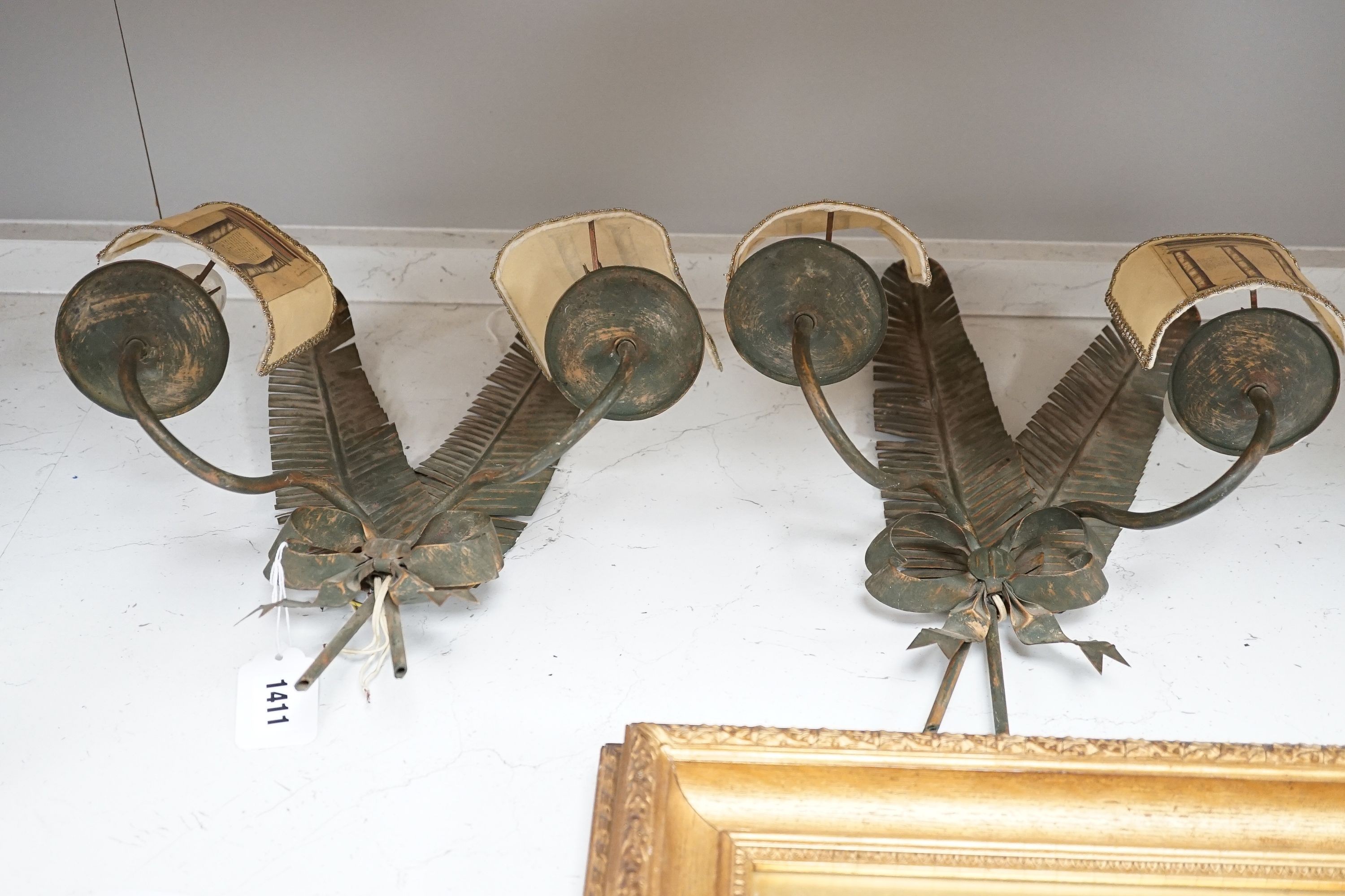 A pair of two branch ‘feather quill’ wall sconces, height 35cm